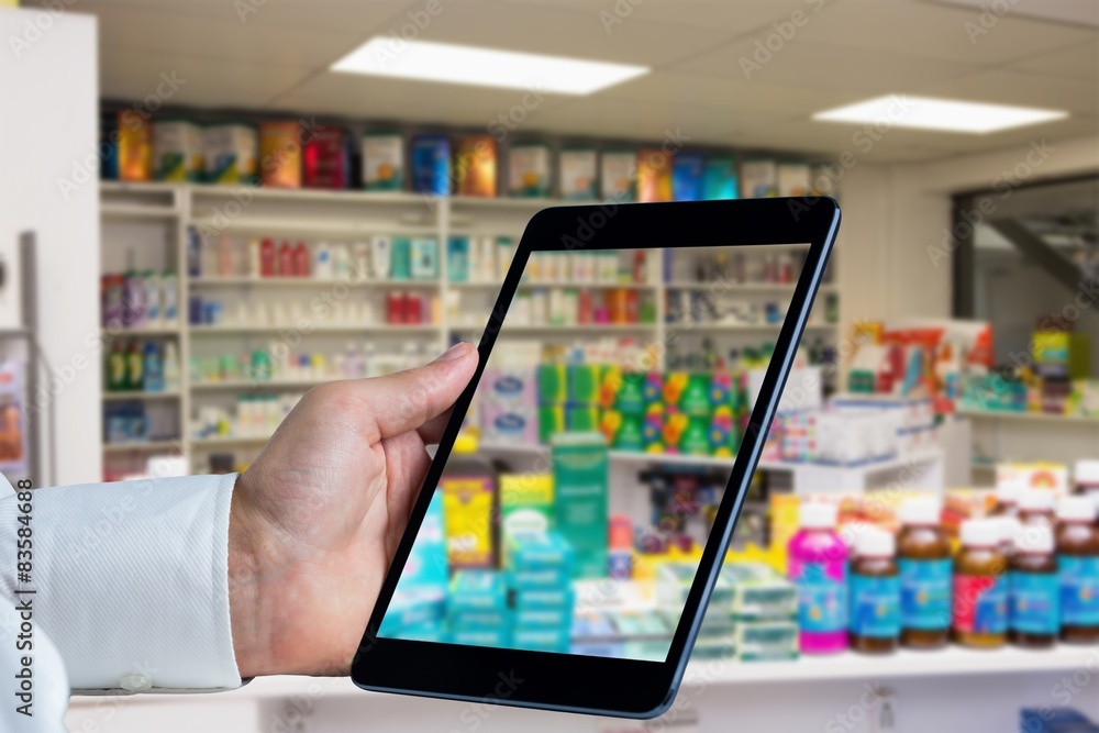 Composite image of man using tablet pc Composite image of man using tablet pc