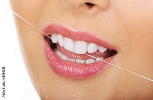 Woman with dental floss.