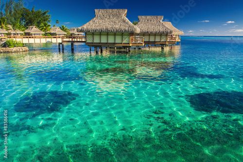 Fototapeta Naklejka Na Ścianę i Meble -  Villas in the lagoon with steps into shallow water with coral