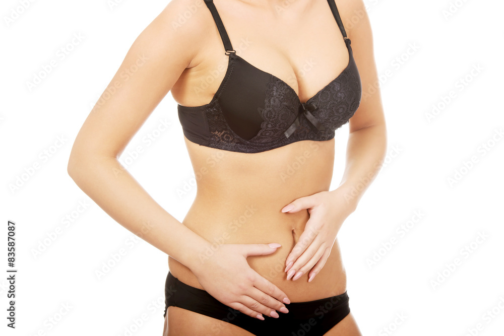 Woman touching her slim belly. Woman touching her slim belly.