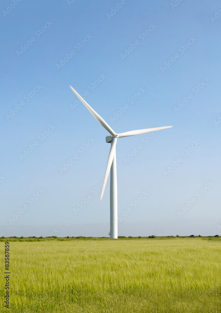 Wind turbine on the beautiful autumn meadow