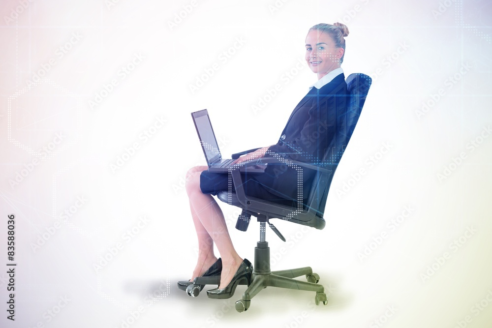 Businesswoman sitting on chair with laptop Businesswoman sitting on chair with laptop