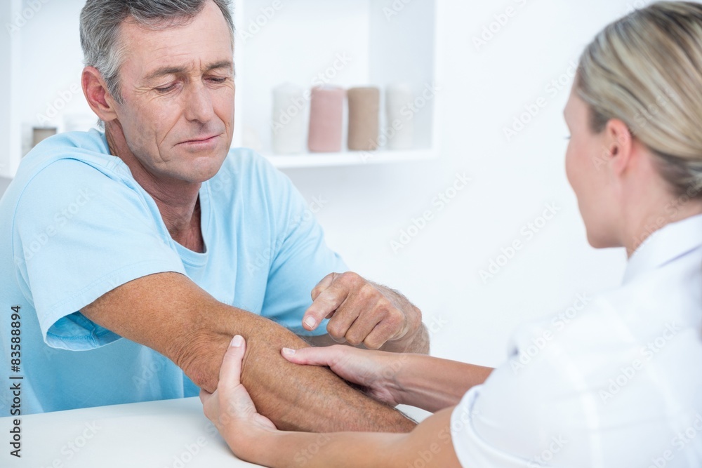 Doctor doing arm massage Doctor doing arm massage