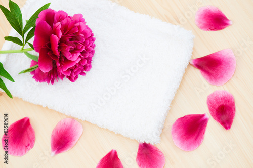  Flower petals and towel spa relax concept 