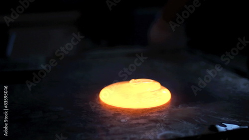 A Piece Of Molten Glass Put On A Metal Pan 
