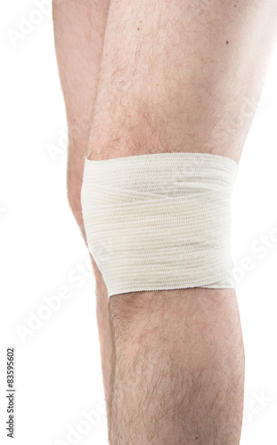 man with elastic bandage on knee