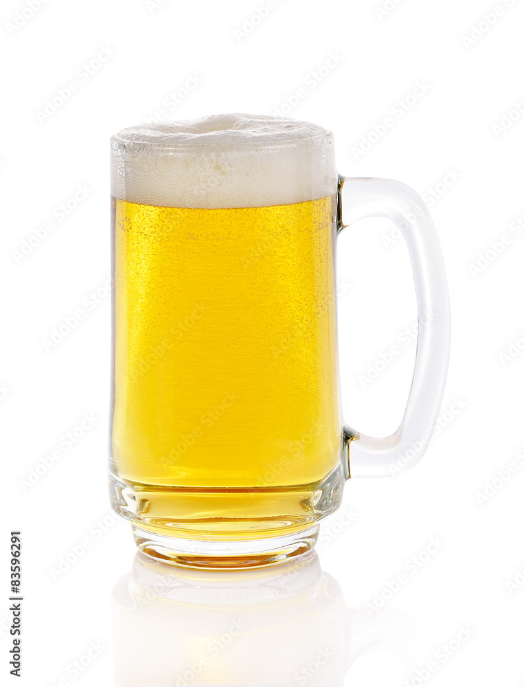 Mug fresh beer with cap of foam isolated on white background Mug fresh beer with cap of foam isolated on white background