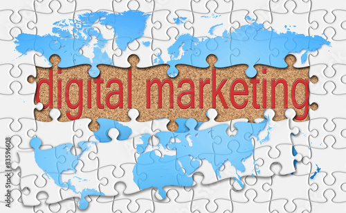 jigsaw reveal digital marketing word on cork background