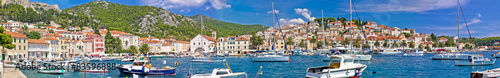 Hvar yachting harbor and historic architecture panoramic