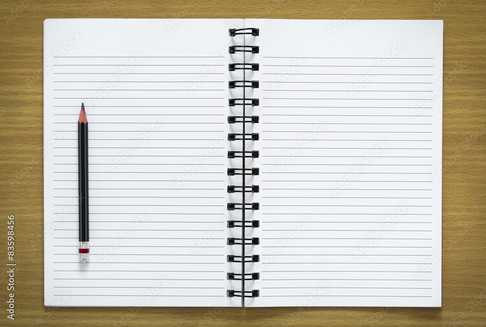 blank spiral notebook and pencil on wood background blank spiral notebook and pencil on wood background