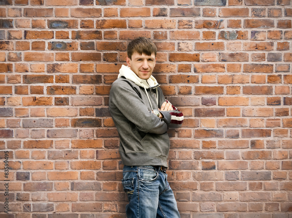 man standing near the wall man standing near the wall
