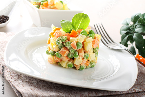 Russian salad with peas, carrots, potatoes and mayonnaise