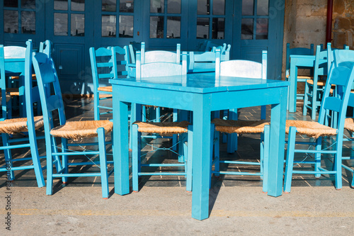 cafe with blue chairs, Crete, Greece © neirfy