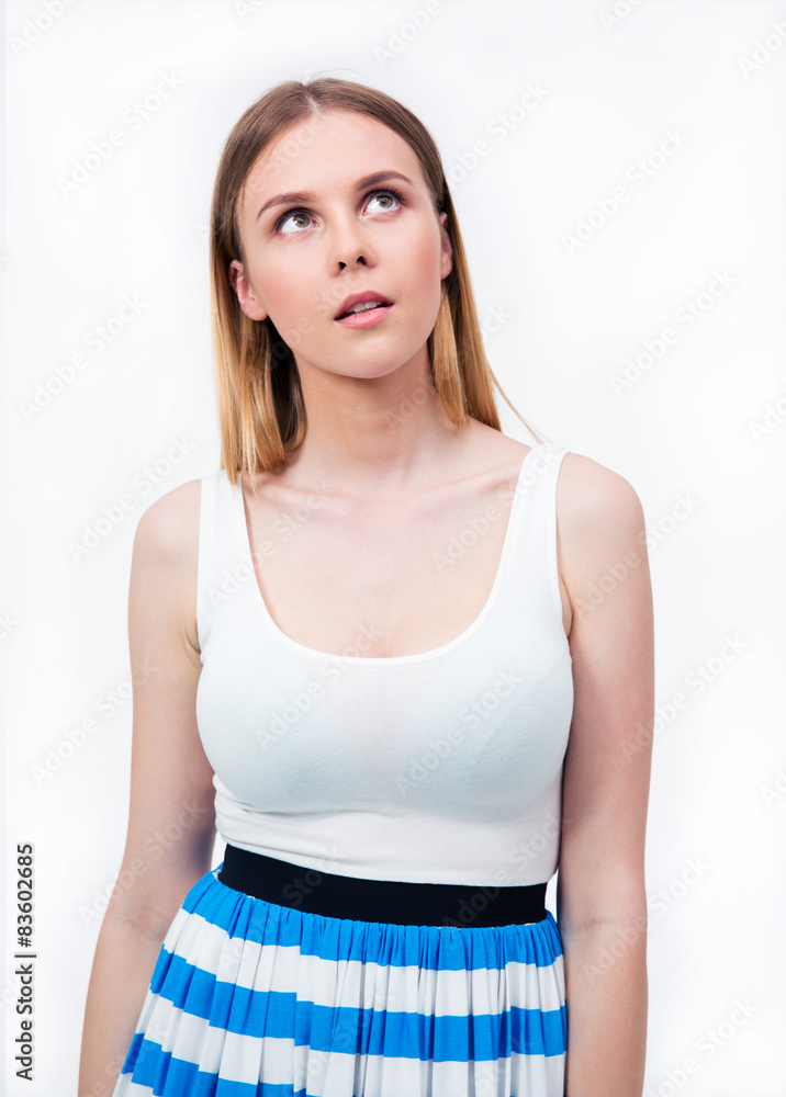 Pensive young woman looking up Pensive young woman looking up