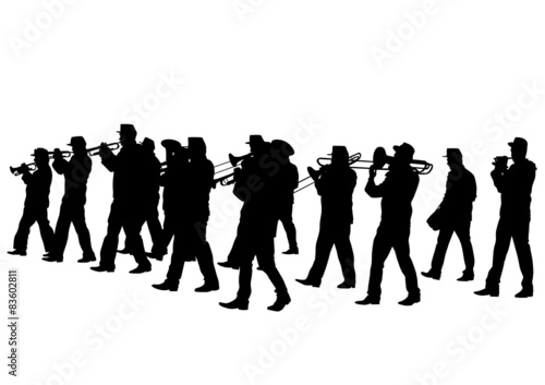 Men walking with a brass instrument