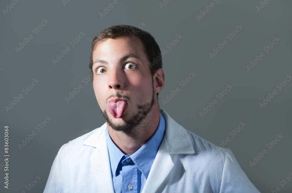 Closeup portrait of handsome playful young doctor Closeup portrait of handsome playful young doctor