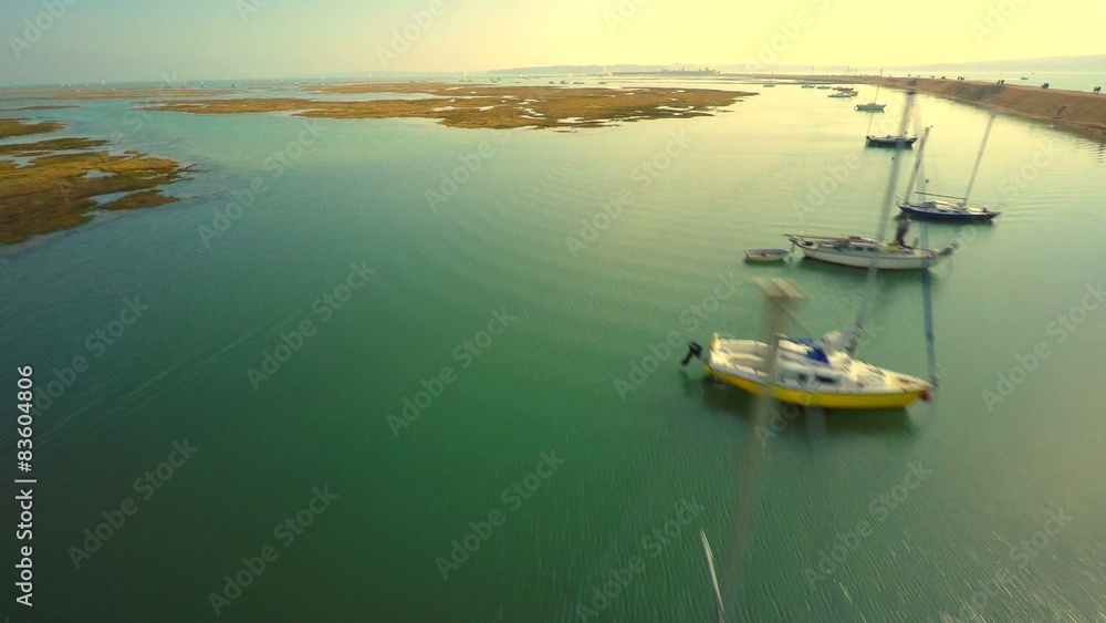 Flight over sea bay with rocks and yacht Flight over sea bay with rocks and yacht