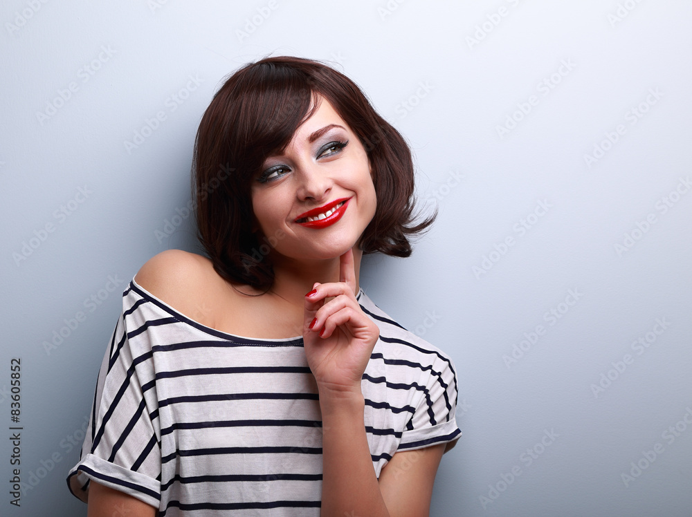 Thinking happy young woman looking on copy space Thinking happy young woman looking on copy space