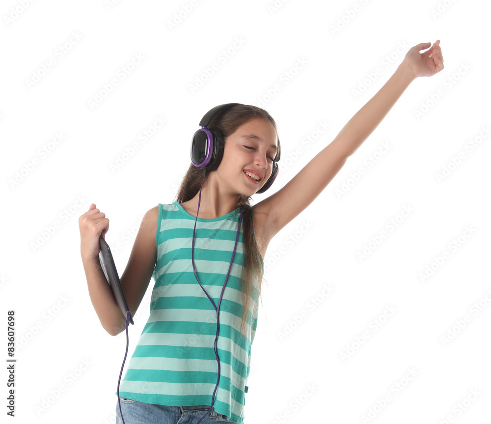 Beautiful pre-teen girl dancing with a tablet Beautiful pre-teen girl dancing with a tablet