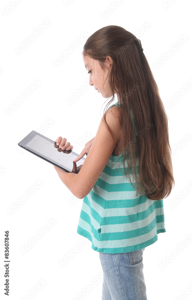 Beautiful pre-teen girl using a tablet computer. Beautiful pre-teen girl using a tablet computer.