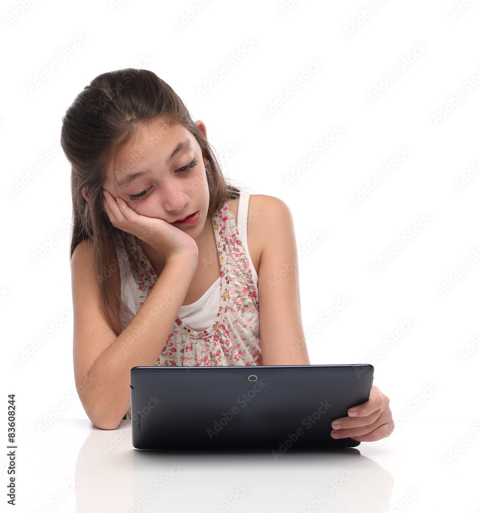 Boring. Pre-teen girl with a tablet computer. Isolated on white Boring. Pre-teen girl with a tablet computer. Isolated on white