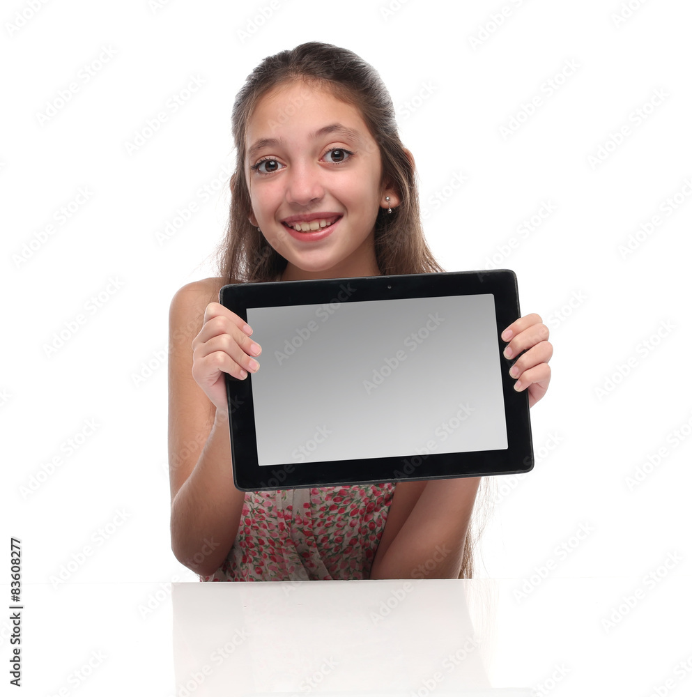 Beautiful pre-teen girl with a tablet computer. Beautiful pre-teen girl with a tablet computer.