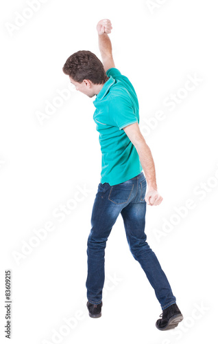 back view of skinny guy funny fights waving his arms and legs.