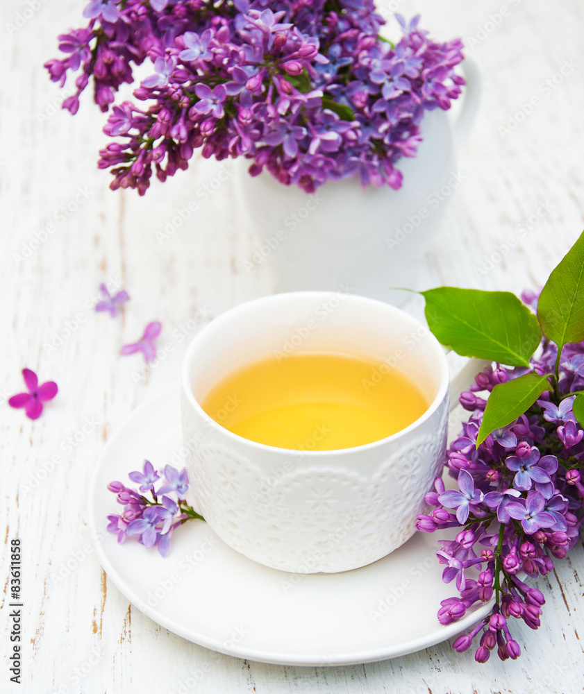 Cup of tea and lilac flowers Cup of tea and lilac flowers