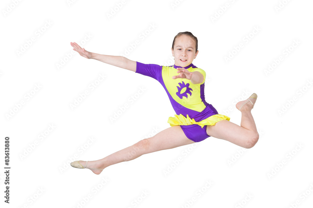 Cute young girl doing gymnastics isolated over white