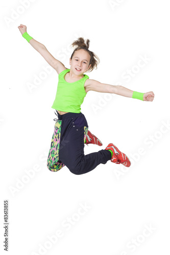 Happy little girl dancing hip-hop isolated on white background
