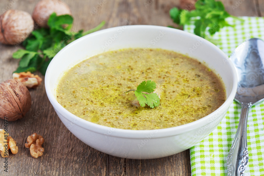 Traditional soup kharcho of beef broth with walnuts, cilantro Traditional soup kharcho of beef broth with walnuts, cilantro