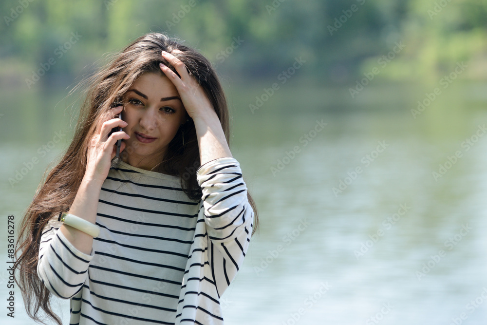 unhappy girl with mobile phone unhappy girl with mobile phone