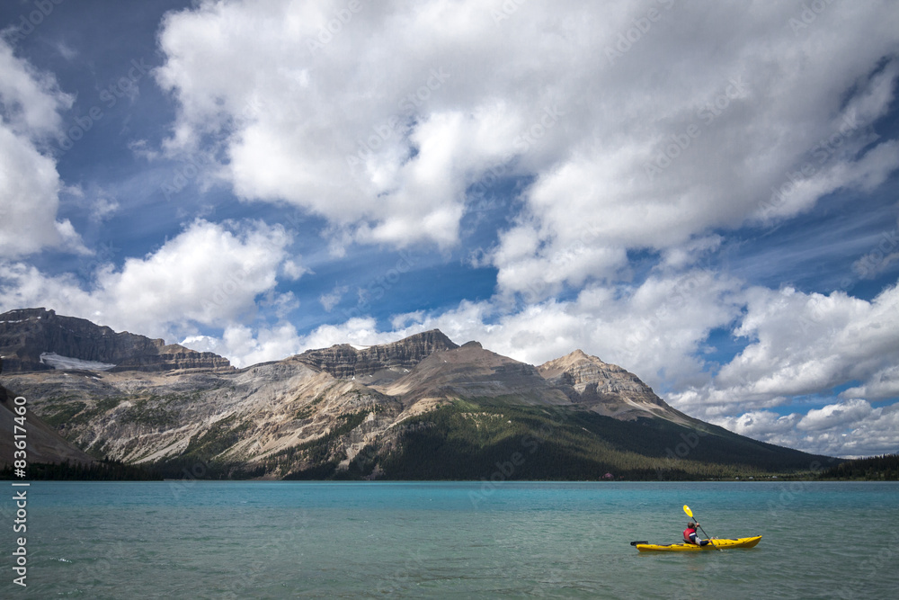 Kyaking on clear blue lake Banff Alberta