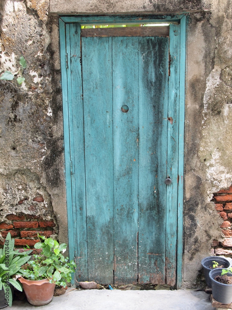 Ancient architecture entrance with old wooden door Ancient architecture entrance with old wooden door