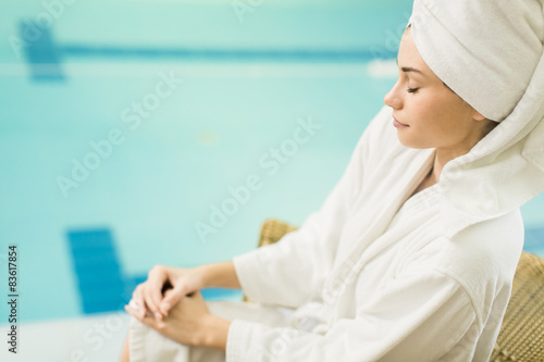 Young woman by the pool