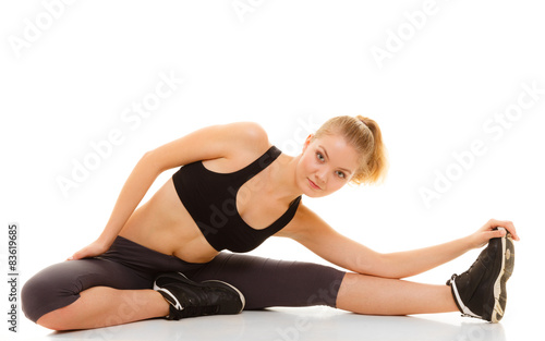woman in sportswear doing stretching exercise