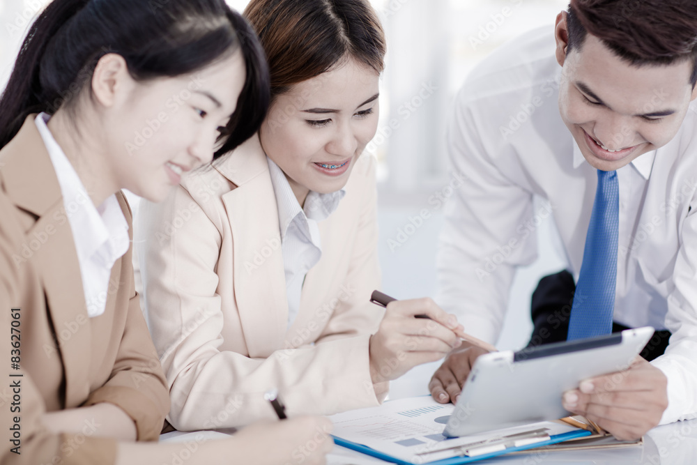 Business people discussing the charts and graphs showing the res Business people discussing the charts and graphs showing the res