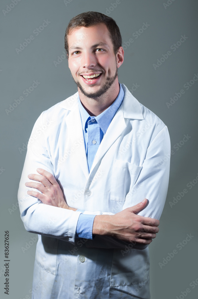 Closeup portrait of handsome young doctor crossing arms Closeup portrait of handsome young doctor crossing arms