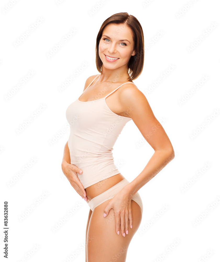 woman in cotton underwear showing slimming concept woman in cotton underwear showing slimming concept