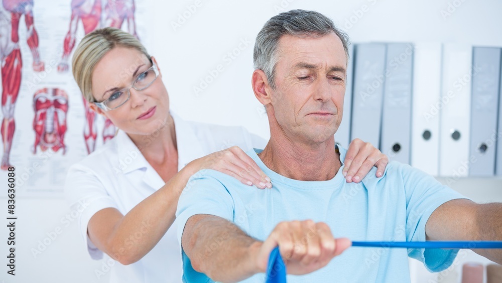Fototapeta premium Doctor examining her patient back 