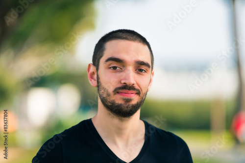 Handsome smiling and casual young man looking