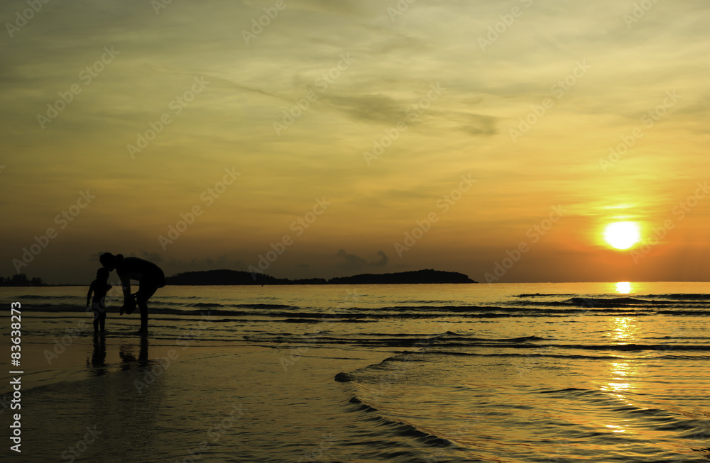 Fototapeta premium Silhouette of mother and son