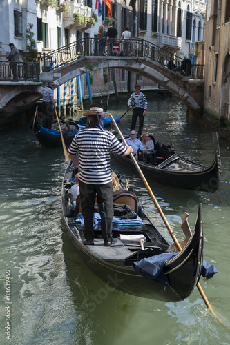 Typical scene from a small canal in Venice with gondolas