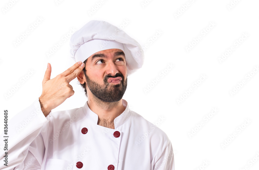 Chef making suicide gesture over white background