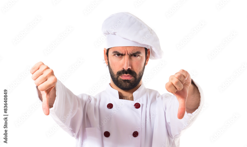 Chef doing a bad signal over white background Chef doing a bad signal over white background
