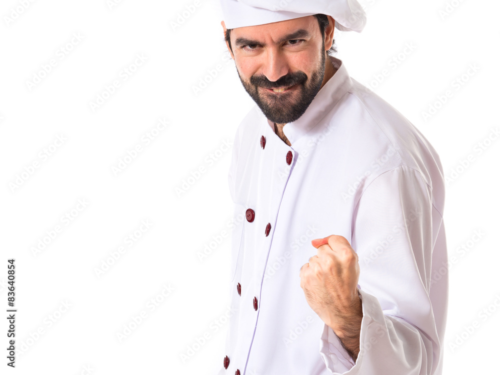 Lucky chef over isolated white background Lucky chef over isolated white background