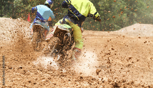 Fotografie motocross racer accelerating speed in track