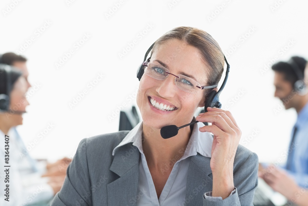 Smiling businessman with headsets looking at camera 