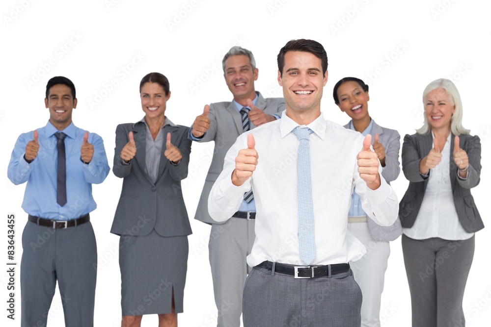 Happy business people looking at camera with thumbs up Happy business people looking at camera with thumbs up