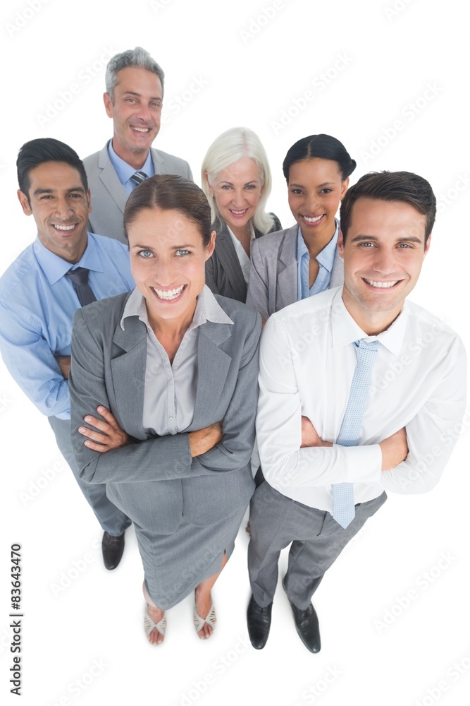 Smiling business people looking at camera with arms crossed Smiling business people looking at camera with arms crossed